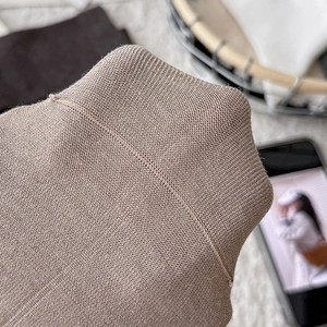 Close-up of beige crew socks showing fine knit texture and durable double-stitched seams