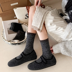 Detailed knit texture of thick winter wool socks with stylish color block patterns