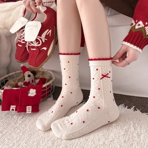 Red polka dot wool socks with bow and lace trim for festive winter home wear