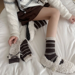 Sweet bowknot and polka dot wool socks paired with white sherpa slippers for winter