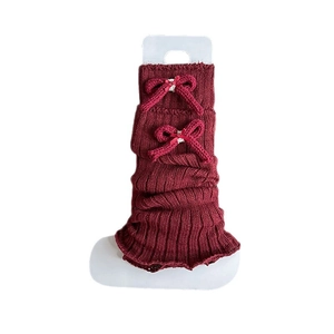 Dark red ballet style leg warmers with bows and ribbed knit texture for winter