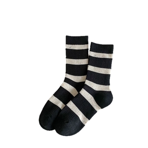Classic black and white striped cotton mid-calf socks with vintage ribbed texture