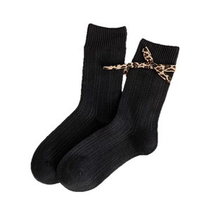 Black ribbed crew socks with leopard print bow tie for women in minimalist style