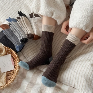 Thick wool knit crew socks for women featuring vintage color-block design in earthy tones