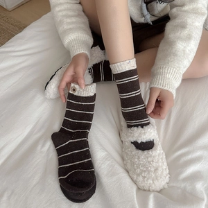 Close-up of vintage wool socks with retro copper button and thick stripe knit texture