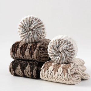 Close-up of thick knitted leg warmers with vintage jacquard patterns for winter