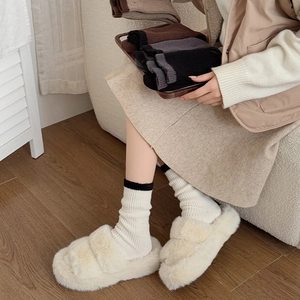 Thick warm winter socks and plush slippers set for home comfort in minimalist style