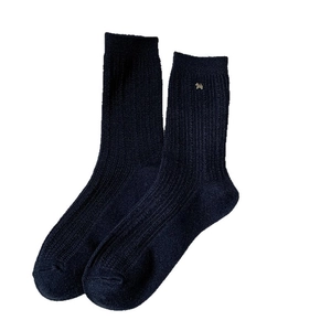 Navy blue vertical striped wool blend socks featuring a gold puppy emblem decoration