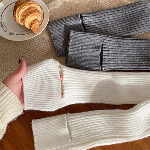 Chic ribbed knit leg warmers with thumb holes and stylish split hem for winter layering