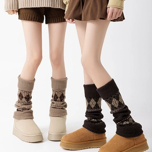 Women's vintage knit leg warmers with argyle pattern paired with stylish snow boots