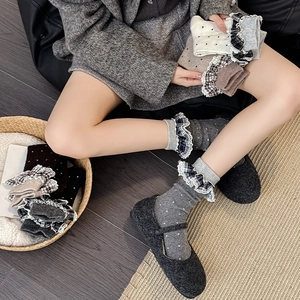 Detail of ruffled plaid cuff and white polka dots on vintage mid-calf wool socks
