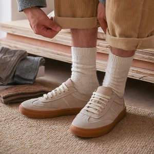Men's retro wool crew socks in beige, styled with corduroy pants and suede sneakers