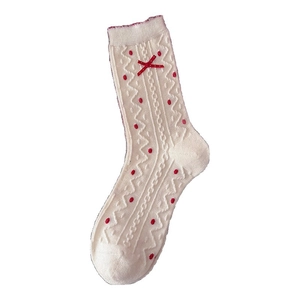 Polka dot bow wool socks in cream and red featuring wave patterns and vintage style