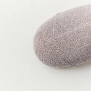 Close-up of fine stitching on the toe of vintage striped wool blend crew socks