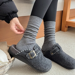 Dark grey felt mule clogs with metal buckle and striped wool socks for winter home comfort