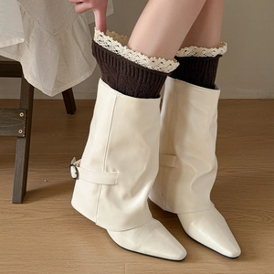 Chic cream slouchy pointed boots with metal buckles and lace trim knit leg warmers