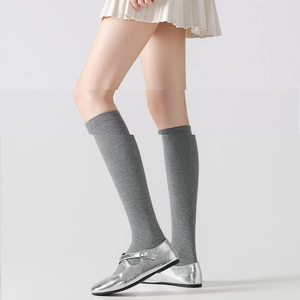 Minimalist grey knee-high socks in solid color featuring a premium knitted texture style