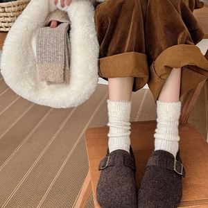 Retro contrast plush socks paired with brown buckle sandals in a warm autumn outfit