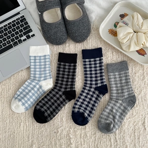 Four pairs of checkered cotton mid-calf socks in blue and white plaid for casual wear