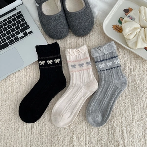 Three-pack of Japanese style wool blend socks with bow patterns and wavy lace cuffs