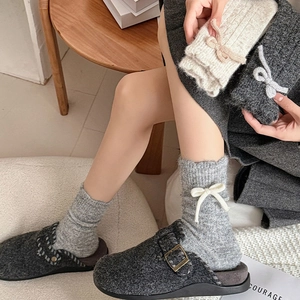 Women wool bow socks with ribbed texture and side ribbon details for winter warmth