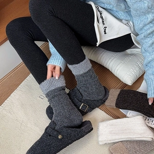 Winter plush拼接 wool blend socks and clogs shown in a cozy home setting for warmth