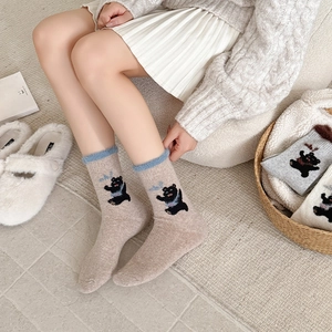 Thick wool socks for women with cartoon bear pattern and blue faux fur trim details