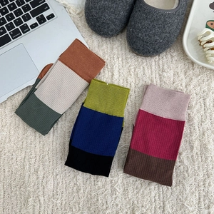 Three pairs of vintage color-block split toe socks with vertical ribbed knit texture
