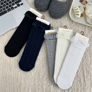 Detailed set of five lace-trim cable knit crew socks in neutral and dark colors
