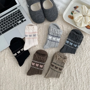 Cozy wool blend knit crew socks for women featuring cute bow patterns in six colors