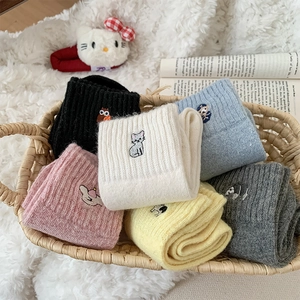 Detail of cute animal embroidery and ribbed texture on thick autumn winter wool socks