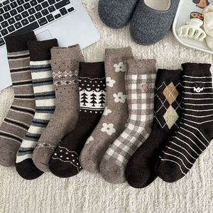 Flat lay of vintage striped embroidery wool socks with cute animal and flower patterns