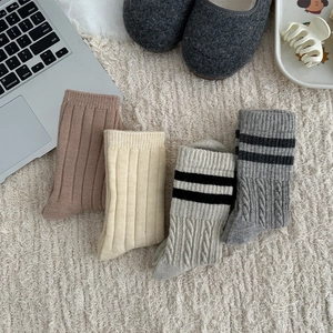 Cozy wool crew socks set in grey and beige colors with vintage cable knit patterns