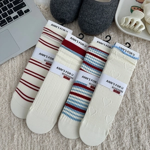 Set di quattro calzini a righe e jacquard a cuore in maglia di cotone testurizzato