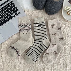 Three pairs of Fair Isle thick wool socks for women with cute dog and bow patterns