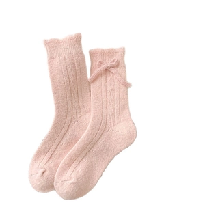 Pink wool-blend bow socks with ribbed texture and ruffled cuffs for women