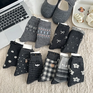 Fair Isle grey wool socks set with Nordic snowflake patterns and thick knit texture