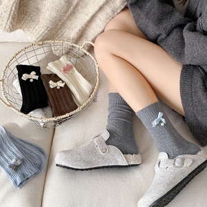 Sweet wool mid-calf socks with vertical stripes, bows and pearls in five soft colors
