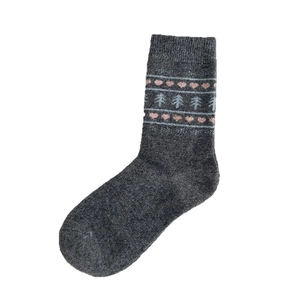 Thick grey Fair Isle wool socks with pink heart and blue tree patterns for winter warmth