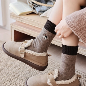 Detail of wool socks with cute dog embroidery and color-block design in khaki shoes
