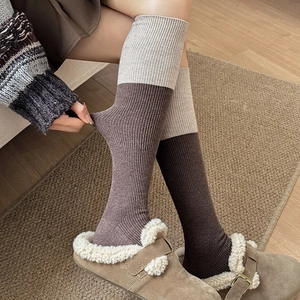 Detailed close-up of elastic ribbed knit wool socks showing stretch fit and comfort