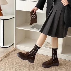 Brown wool socks with bear embroidery and ruffle trim styled with platform loafers
