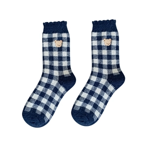Blue plaid knit socks with bear embroidery and ruffle trim, displayed on white background