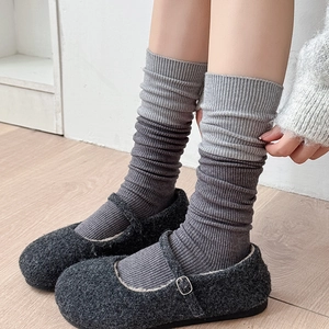 Close-up of ribbed texture and grey color block details on wool slouch socks