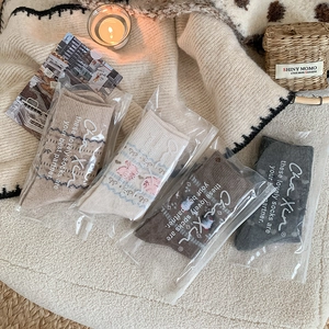 Detail of four-color thick winter bear socks in premium zip-lock packaging bags