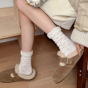 Women's brown suede clogs with faux shearling lining and white polka dot crew socks