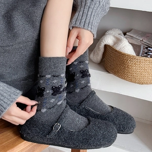 Deep grey mid-calf cat socks paired with plush Mary Jane shoes for autumn and winter