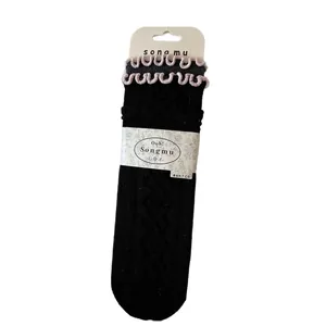Retro diamond pattern wool socks in black with pink ruffled edges for winter warmth