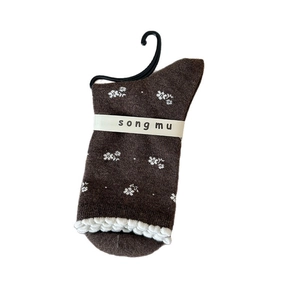 Floral crew socks for women in brown with white floral patterns and ruffled cuff