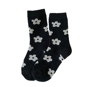 Vintage floral wool mid-calf socks in black with white flower pattern and ribbed cuffs